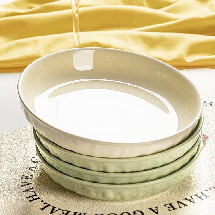 Cream ceramic dinner plate with hand-pressed texture and deepened rim design