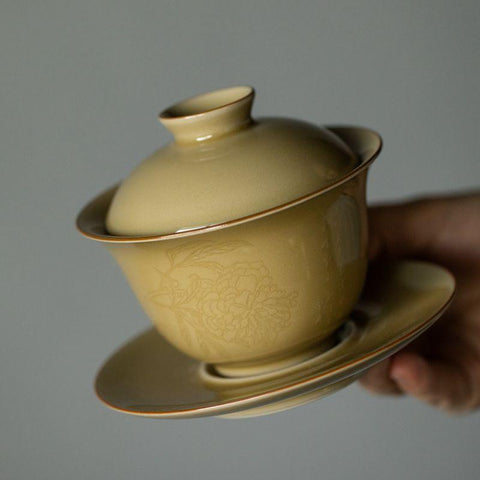 Imitation Ding Kiln Yellow Gaiwan with Floral Engraving Imitation Ding Kiln Yellow Gaiwan with Floral Engraving