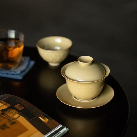 Imitation Ding Kiln Yellow Gaiwan with Floral Engraving Imitation Ding Kiln Yellow Gaiwan with Floral Engraving