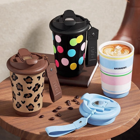 Pastel-striped thermal coffee cup with ceramic liner Pastel-striped thermal coffee cup with ceramic liner