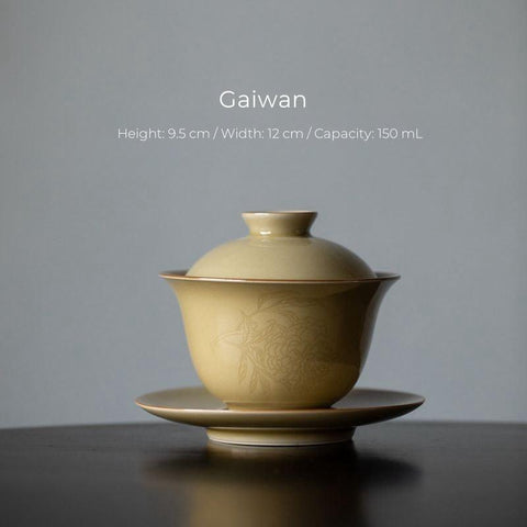 Imitation Ding Kiln Yellow Gaiwan with Floral Engraving Imitation Ding Kiln Yellow Gaiwan with Floral Engraving