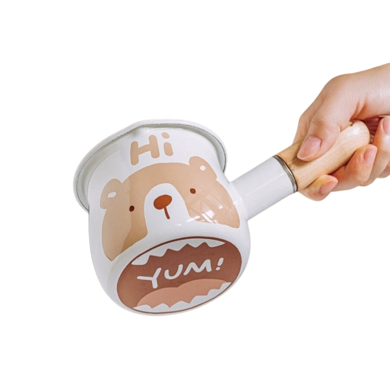 Dual spouts pouring sauce from mini enamel pot - left/right handed design