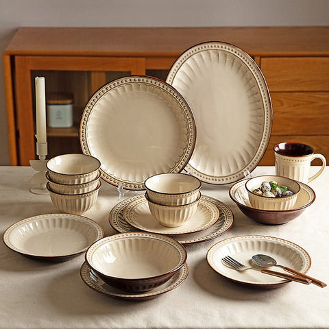 Modern Housewife vintage relief dinnerware set on a rustic wooden table