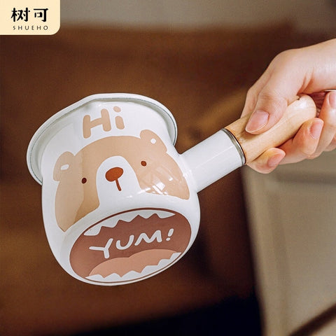 Brown bear enamel milk pan with wooden handle - flips to show hidden bear on base