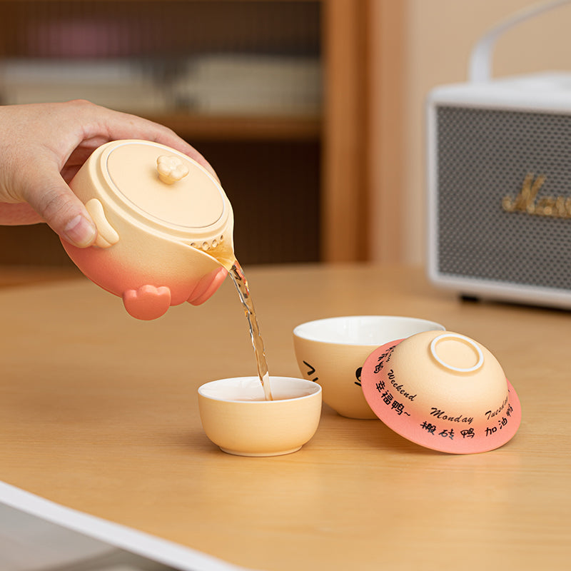 JIA YOU YA ceramic travel tea set with rotating duck lid and portable storage bag.