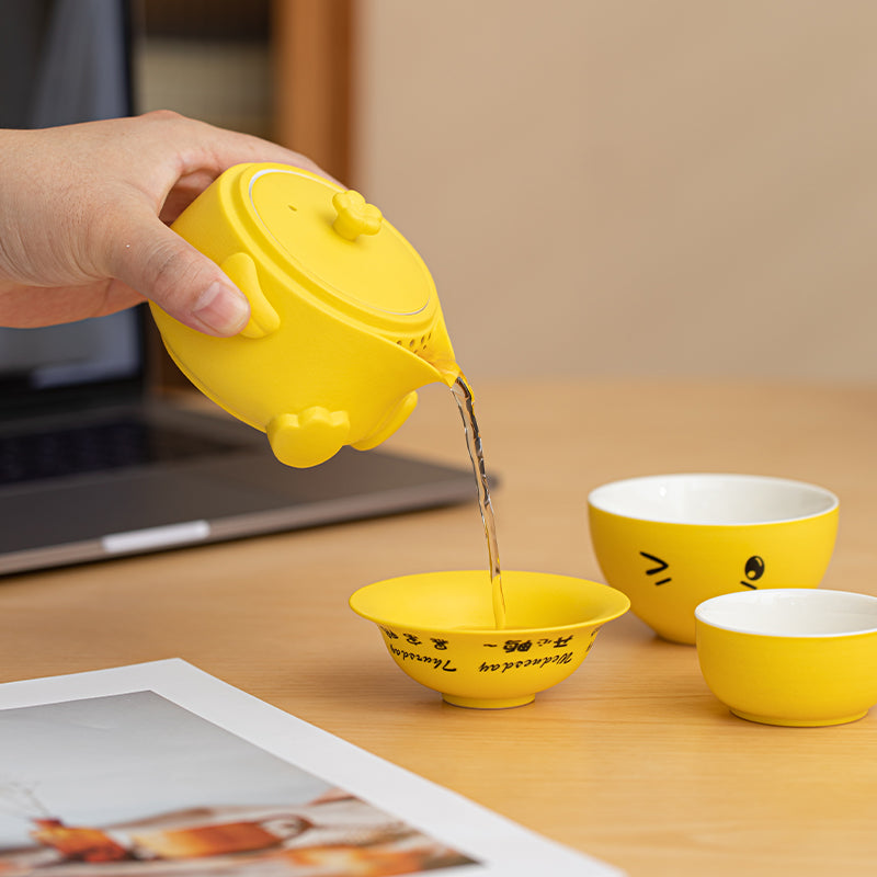 JIA YOU YA ceramic travel tea set with rotating duck lid and portable storage bag.
