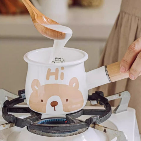 Brown bear enamel milk pan with wooden handle - flips to show hidden bear on base